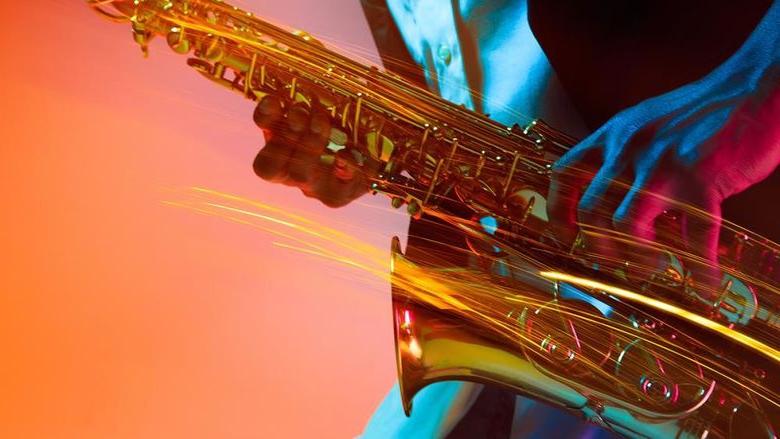 a close-up of a saxophone being played